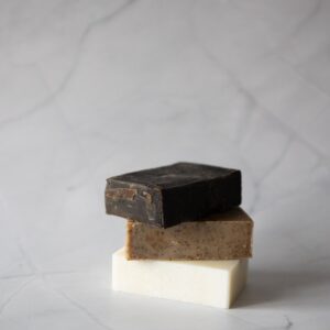 Three different soaps stacked on top of each other.